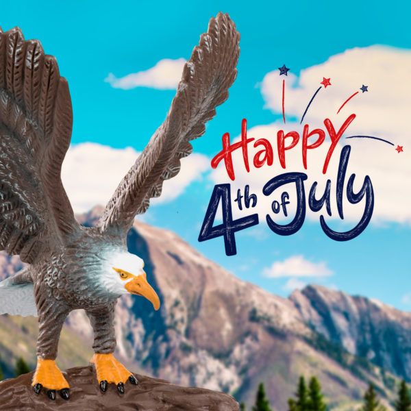 eagle in mountains with fourth of July greeting text