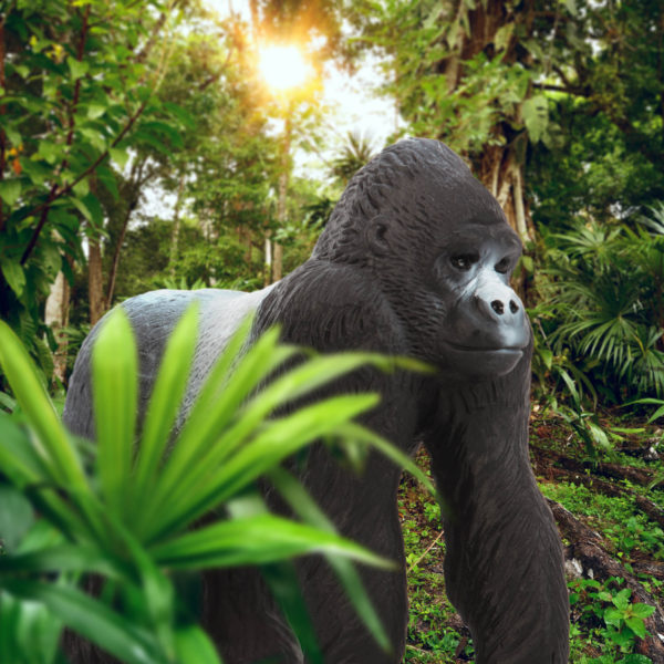 Toy gorilla figurine in jungle