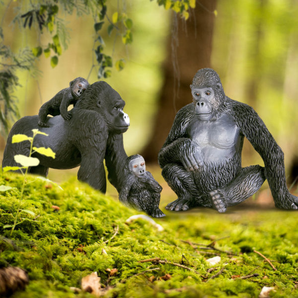 Toy gorilla figurines in jungle